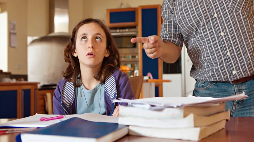 Annoyed child doing homework