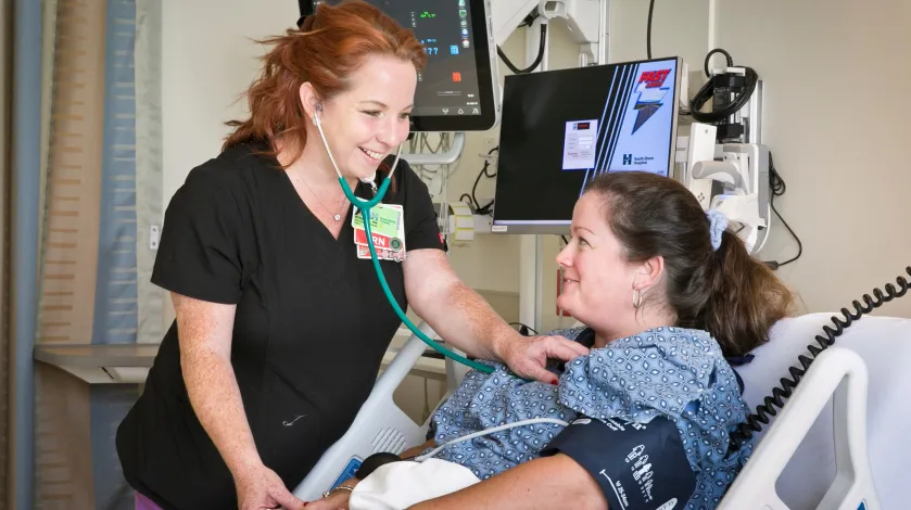 A patient and nurse in South Shore Hospital's new stepdown unit