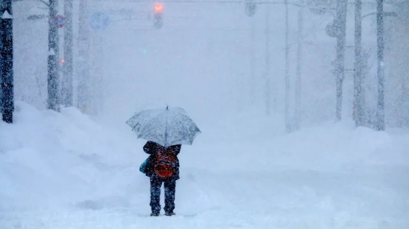 Man walking in a snowstorm
