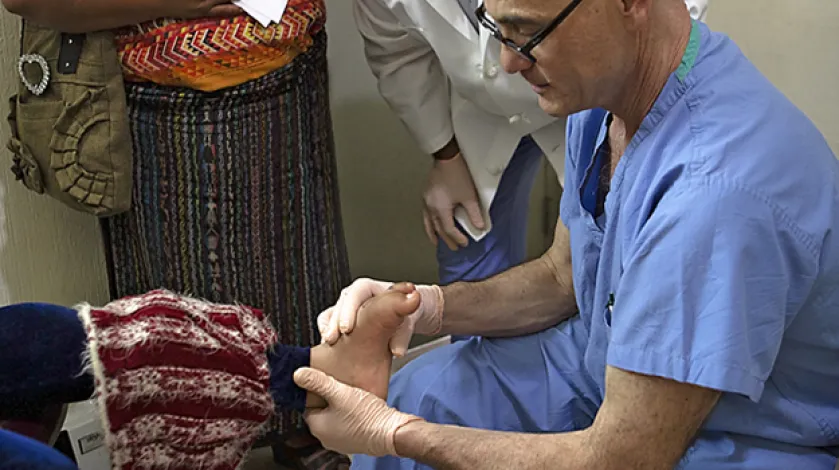 Dr. Perlick examines a Guatemalan patient