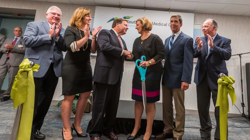 Members of the South Shore Health Board, clinical leadership, and Quincy Mayor Tom Koch celebrate the ceremonial ribbon cutting of SSMC Quincy