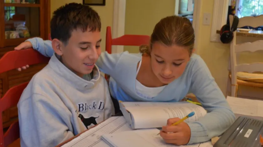 The author's two children learning at home
