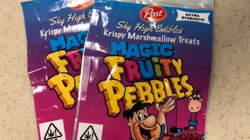 Two packages of Fruity Pebbles-themed THC edibles.