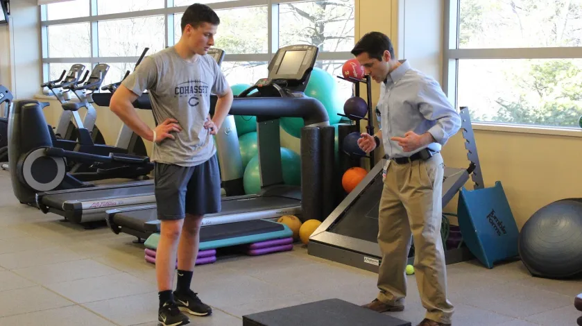 Dan Murray PT works with local athlete Nick Hall on physical therapy