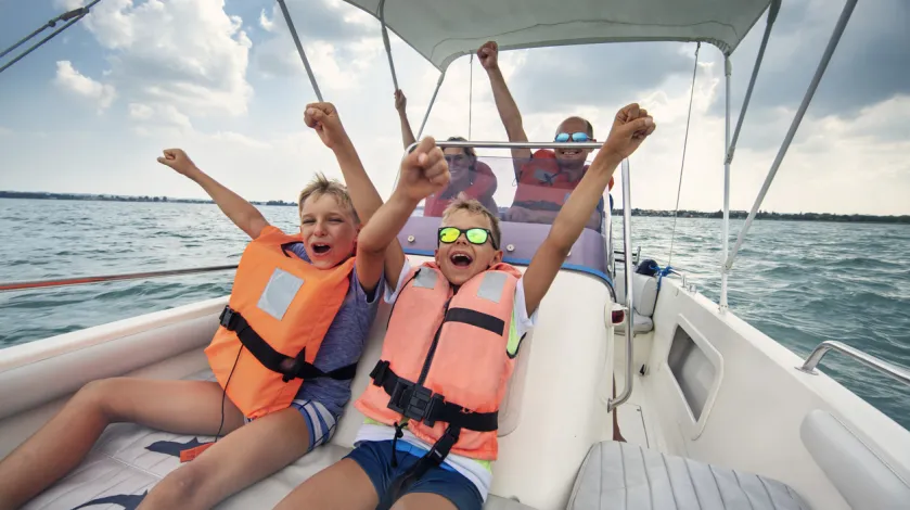 A family happily rides in a boat