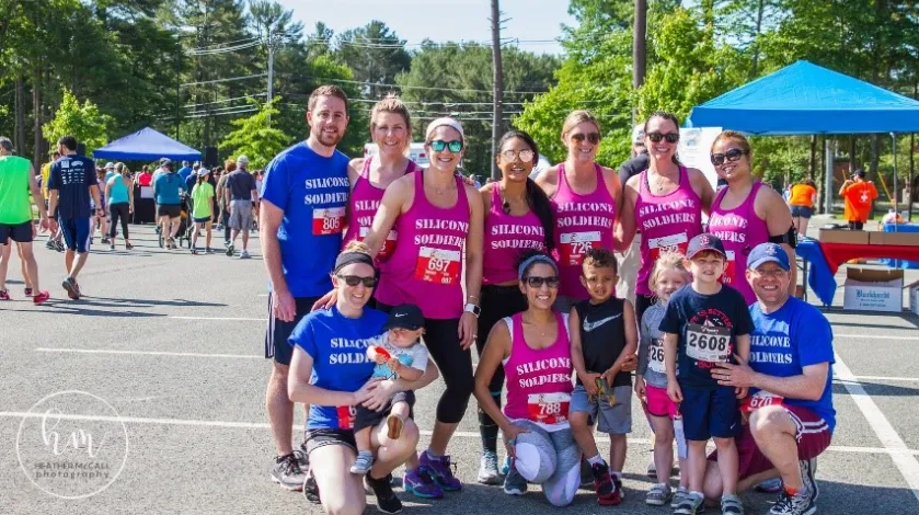 A group of runners poses at the Set the Pace road race.
