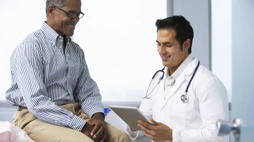 African American man speaks with his doctor