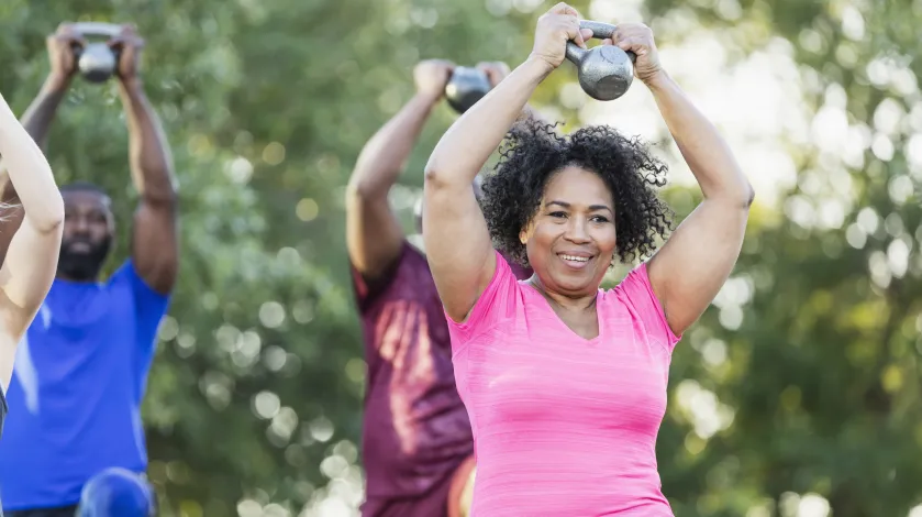 Woman working out with others in an exercise class