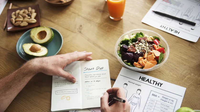 A woman works on planning a healthy diet