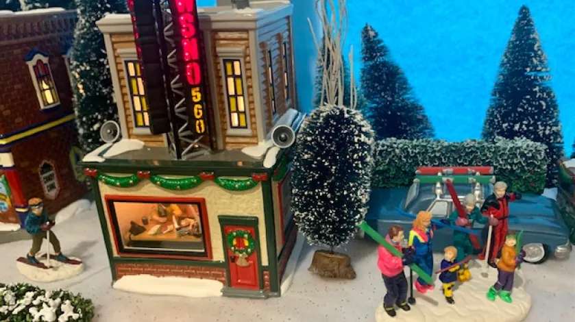 A radio station building and skier figurines