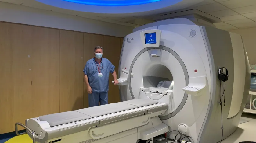 An MRI technologist with a new MRI machine at South Shore Hospital