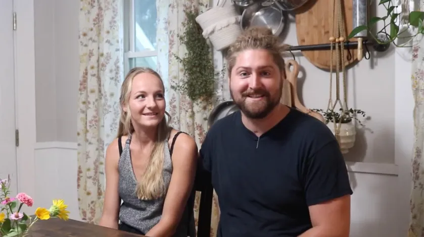 Mikayla and Vinny Fischer sit at their kitchen table as they discuss his upcoming participation in the 2022 Amputee Football World Cup.