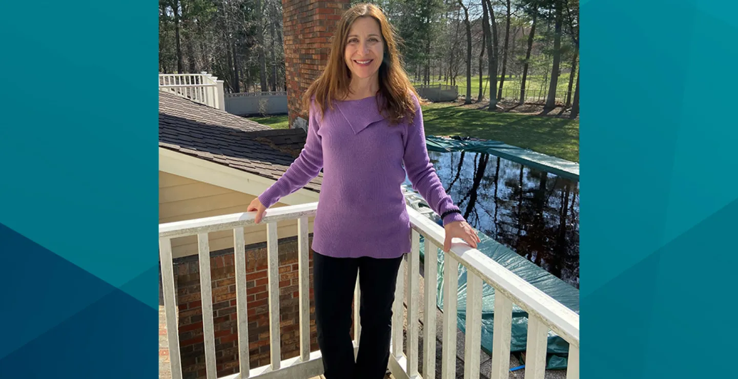 Patient Jo-Ann stands on her deck for a photo. Jo-Ann shared her story of her same-day joint replacement procedure at South Shore Health.
