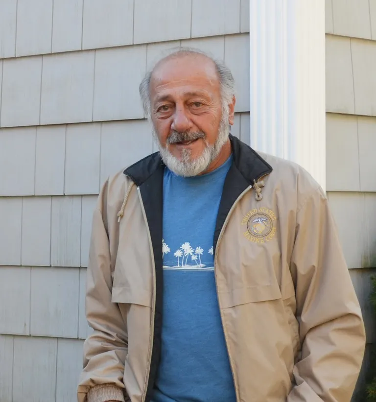 Richard Lalond of Weymouth stands for a portrait in his backyard.