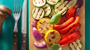 Cutting bored with various sliced grilled vegetables
