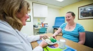 Nutritionist with patient