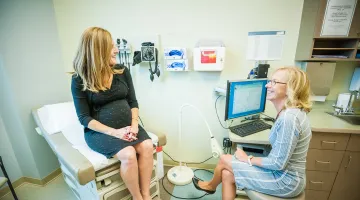 Woman talking to OBGYN