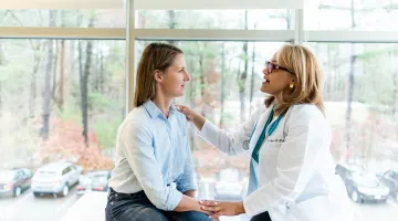 Dr. Leyda Delgado with patient