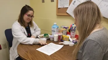 A registered dietitian discussion nutrition plan with a patient at South Shore Hospital