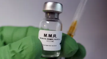 Doctor holding MMR vaccine
