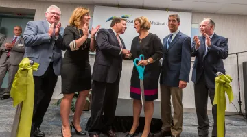 Members of the South Shore Health Board, clinical leadership, and Quincy Mayor Tom Koch celebrate the ceremonial ribbon cutting of SSMC Quincy
