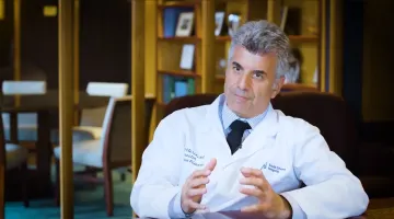 Todd Ellerin, MD, explaining COVID-19 in a medical office