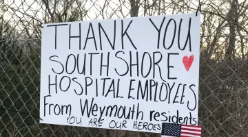 Photo of shuttle lot sign thanking South Shore Health employees