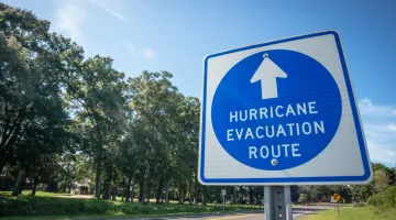 A sign showing the hurricane evacuation route on a roadway