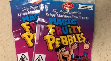 Two packages of Fruity Pebbles-themed THC edibles.