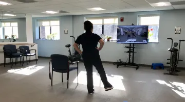 An instructor leads a virtual exercise class