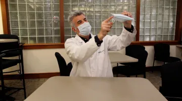 Todd Ellerin shows the knot and tuck method for masks