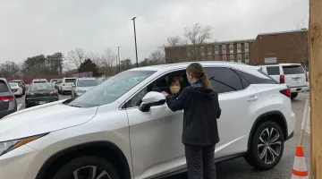 Weymouth resident Jill Reddish receives the town's 10,000th COVID-19 test.