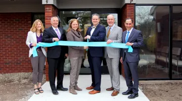 A group of South Shore Health leaders cuts the ribbon on 797 Main Street