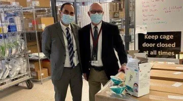 Allen Smith, MD, MS, President & CEO, South Shore Health, stands alongside James “Barry” O’Shaughnessy, who recently pinpointed a counterfeit shipment of N95 surgical masks