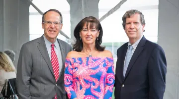 Chris Oddleifson, Rosemary Phalen, and Jim Phalen pose for a photo at South Shore Health's 2021 Luminaria event.