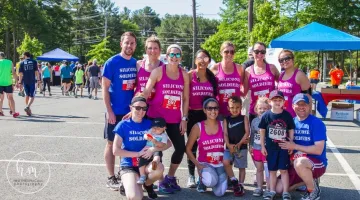 A group of runners poses at the Set the Pace road race.