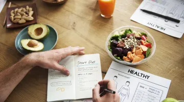 A woman works on planning a healthy diet