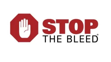The Stop the Bleed logo, featuring red and black text reading STOP THE BLEED with a white hand over a red stop sign
