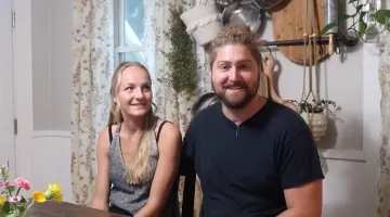 Mikayla and Vinny Fischer sit at their kitchen table as they discuss his upcoming participation in the 2022 Amputee Football World Cup.