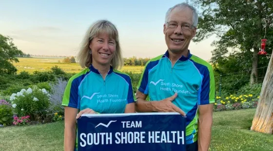 Len and Laura with PMC Banner